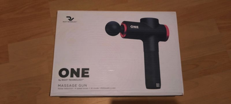 "One" Massagepistole in ihrer Originalverpackung